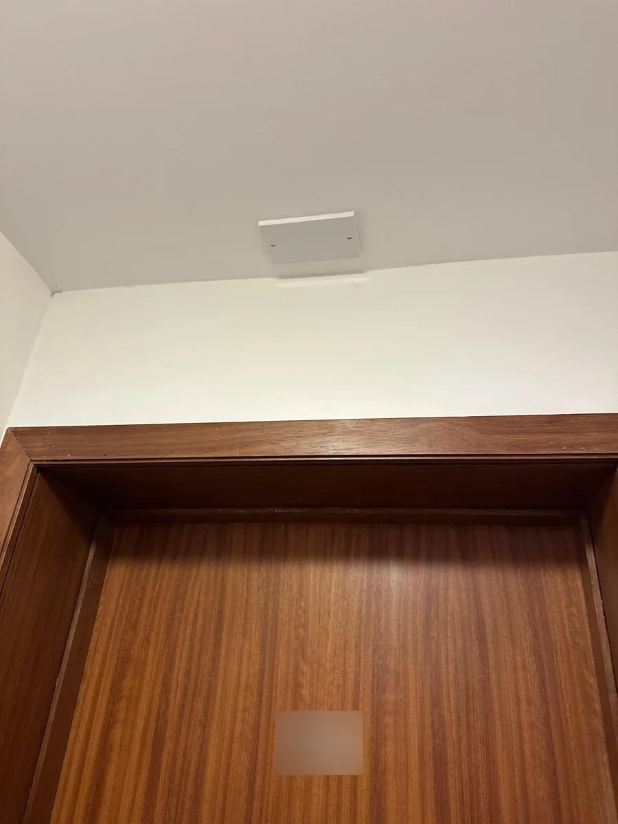 Fibre termination box fitted above an apartment door