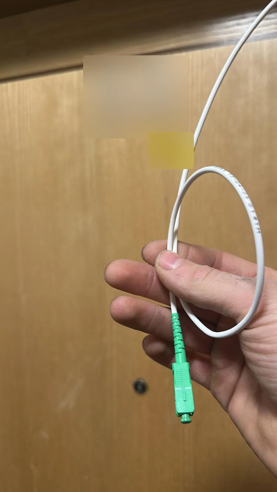 Fibre drop ready to connect at an apartment door